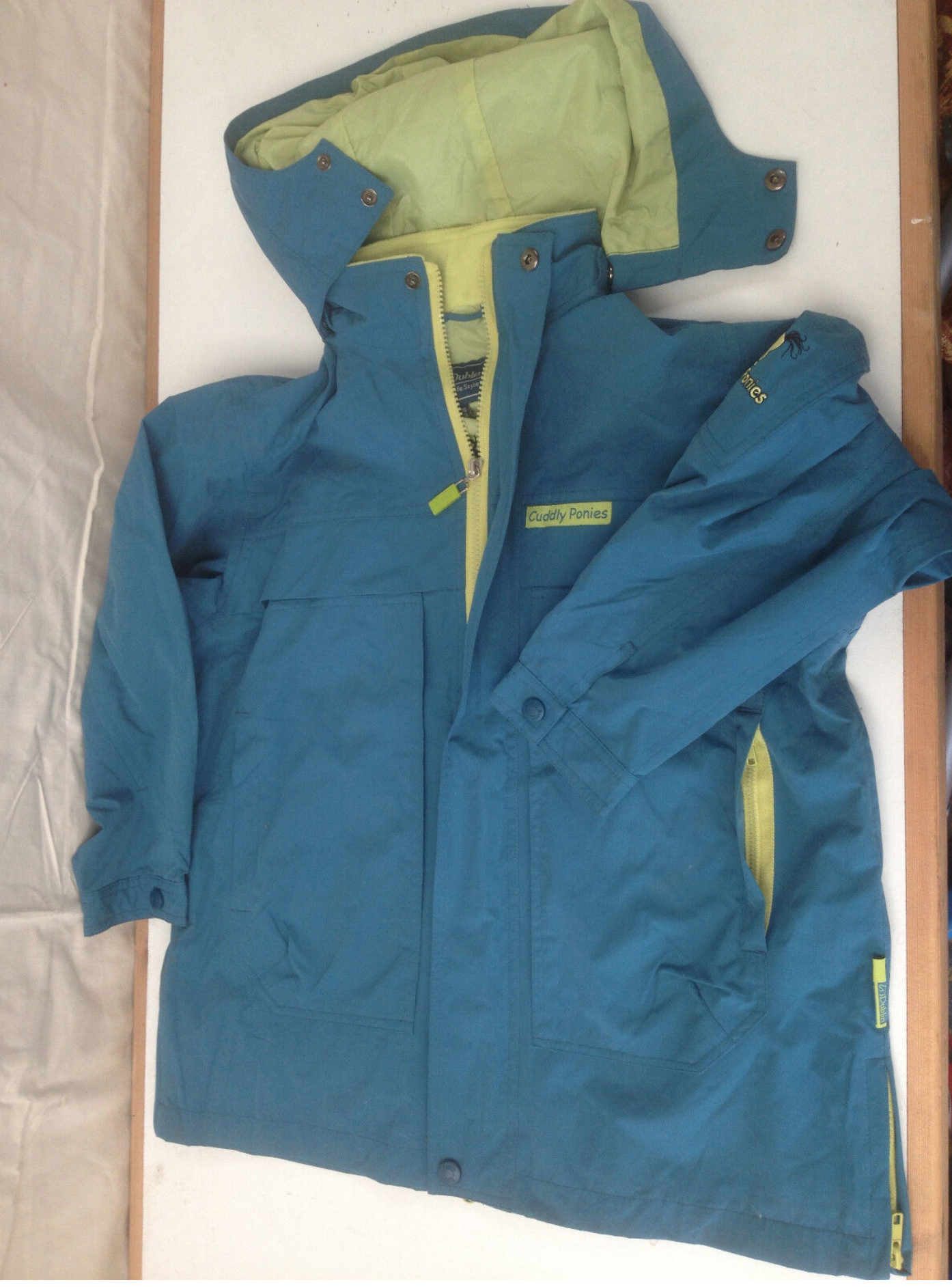 Childs Waterproof Coat Blue Green Cuddly Ponies  Age 8-12